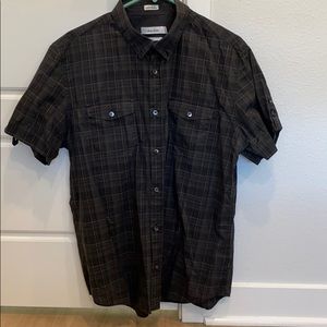 Calvin Klein button up. Sleeves have buttons.